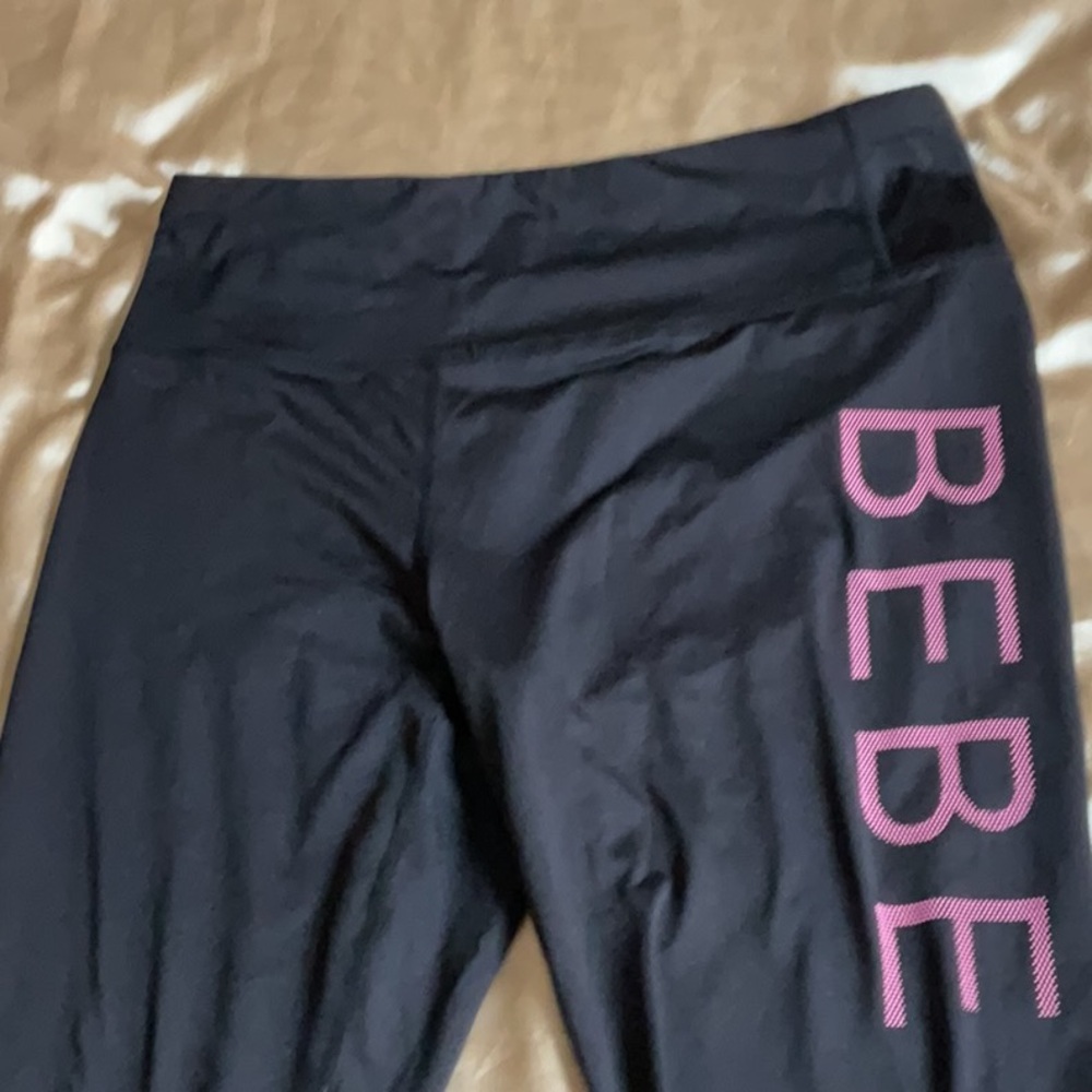 Bebe Sport new Black Leggings, Pink graphic Logo on Left leg, Size L,super cute!